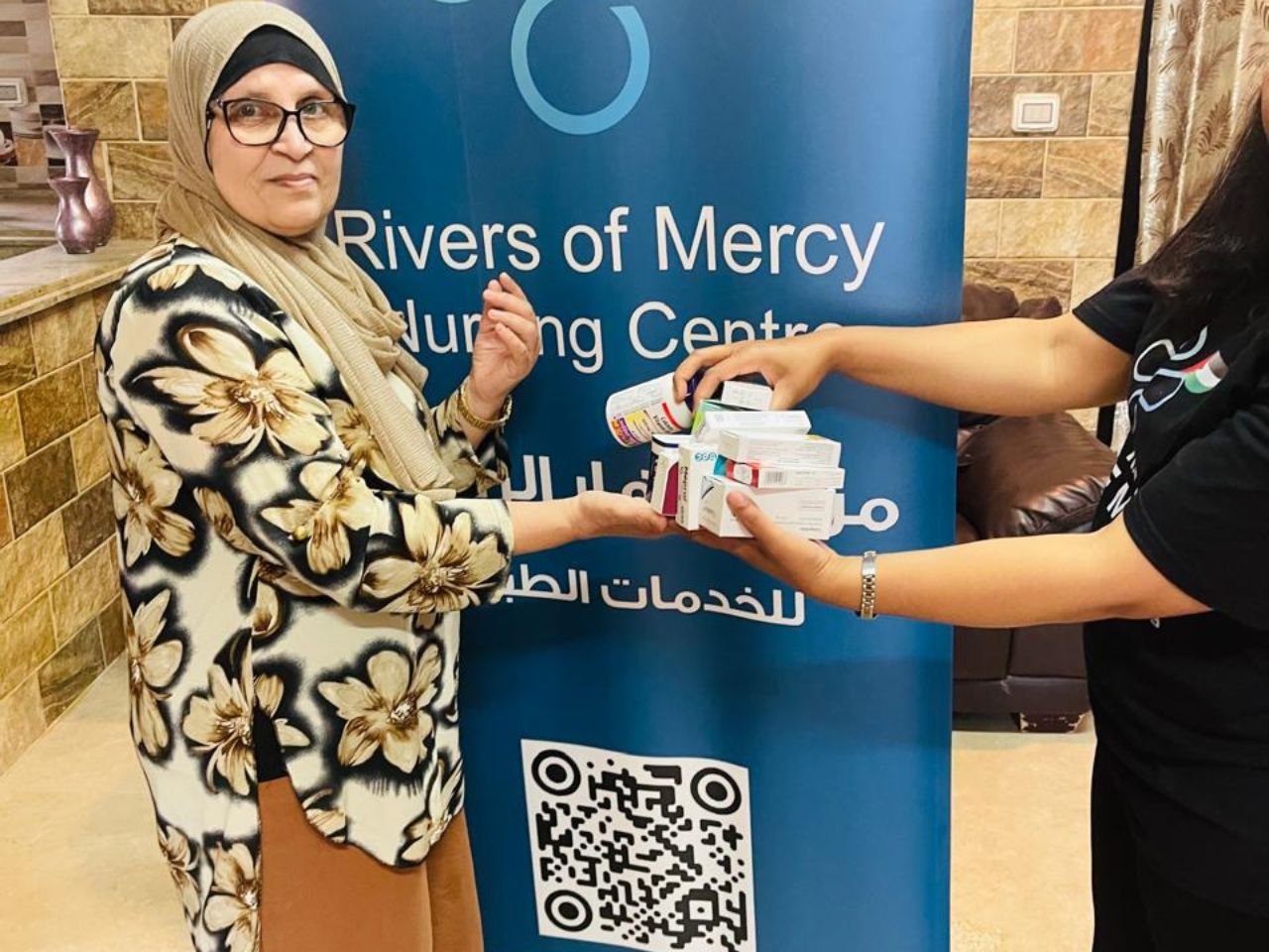 muslim woman receiving free medication at rivers of mercy clinic