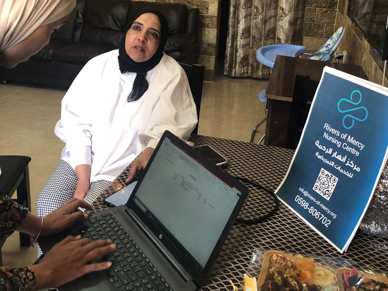 dr giving medical care to a muslim woman 