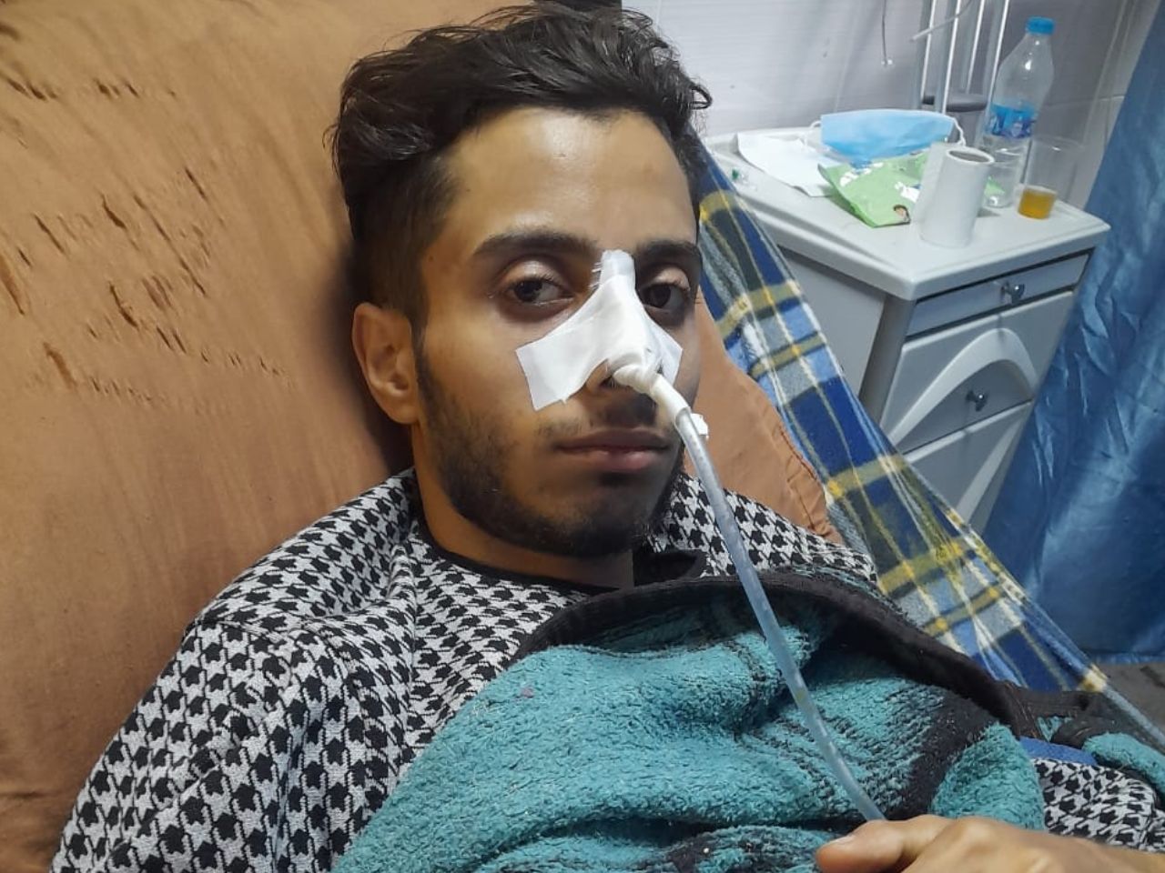 sick man in hospital bed