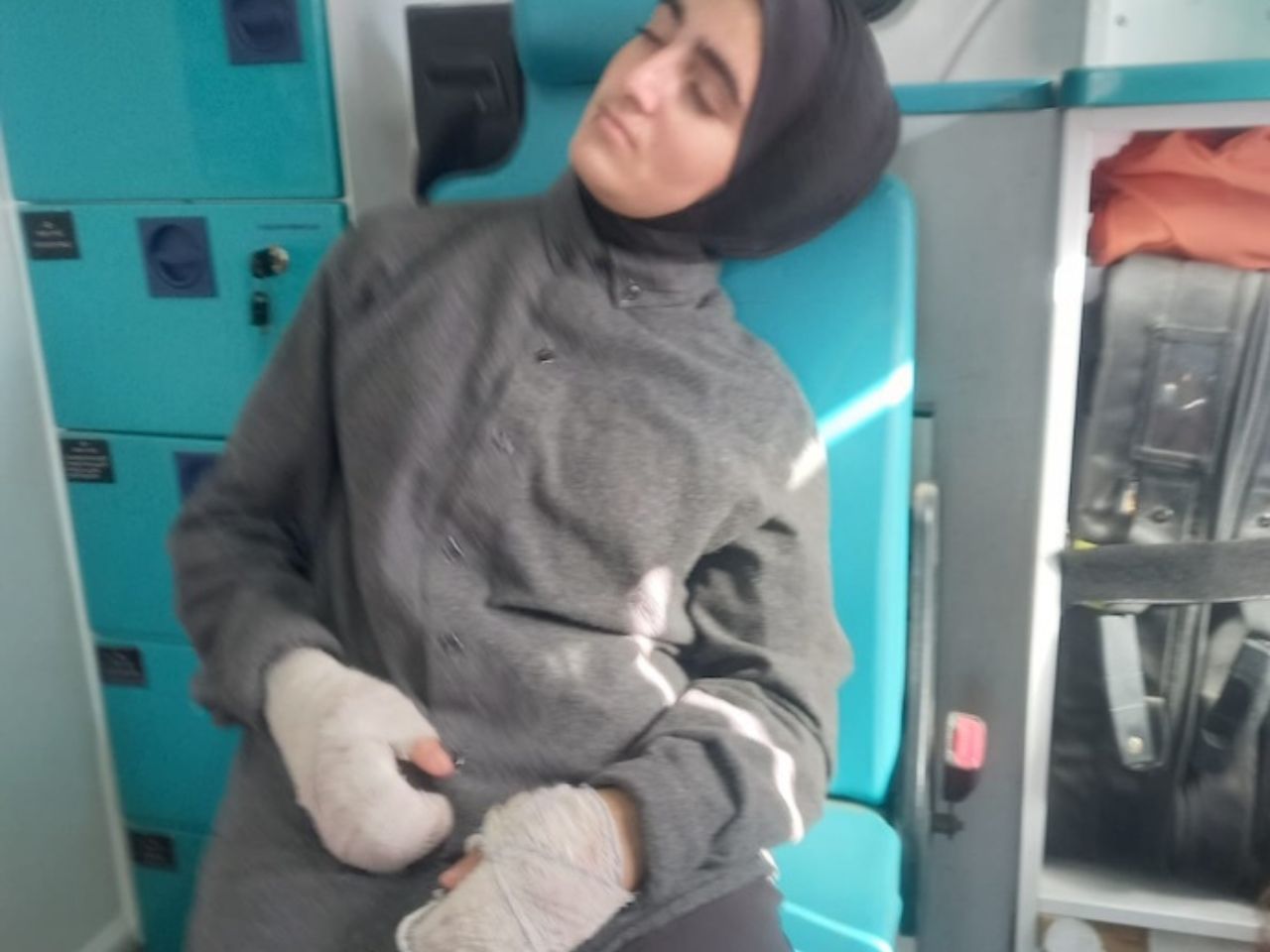 muslim girl with bandaged hands